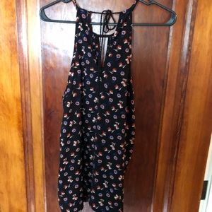 Black with flowers dressy tank . Slightly used , good condition.